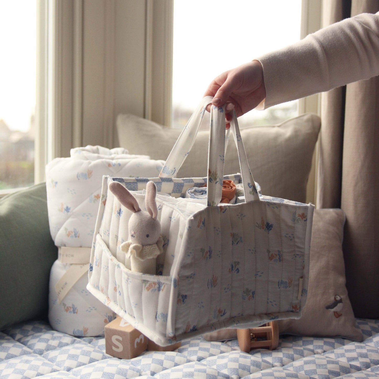 Avery Row - Nappy Caddy (Coastline) - stock photo holding
