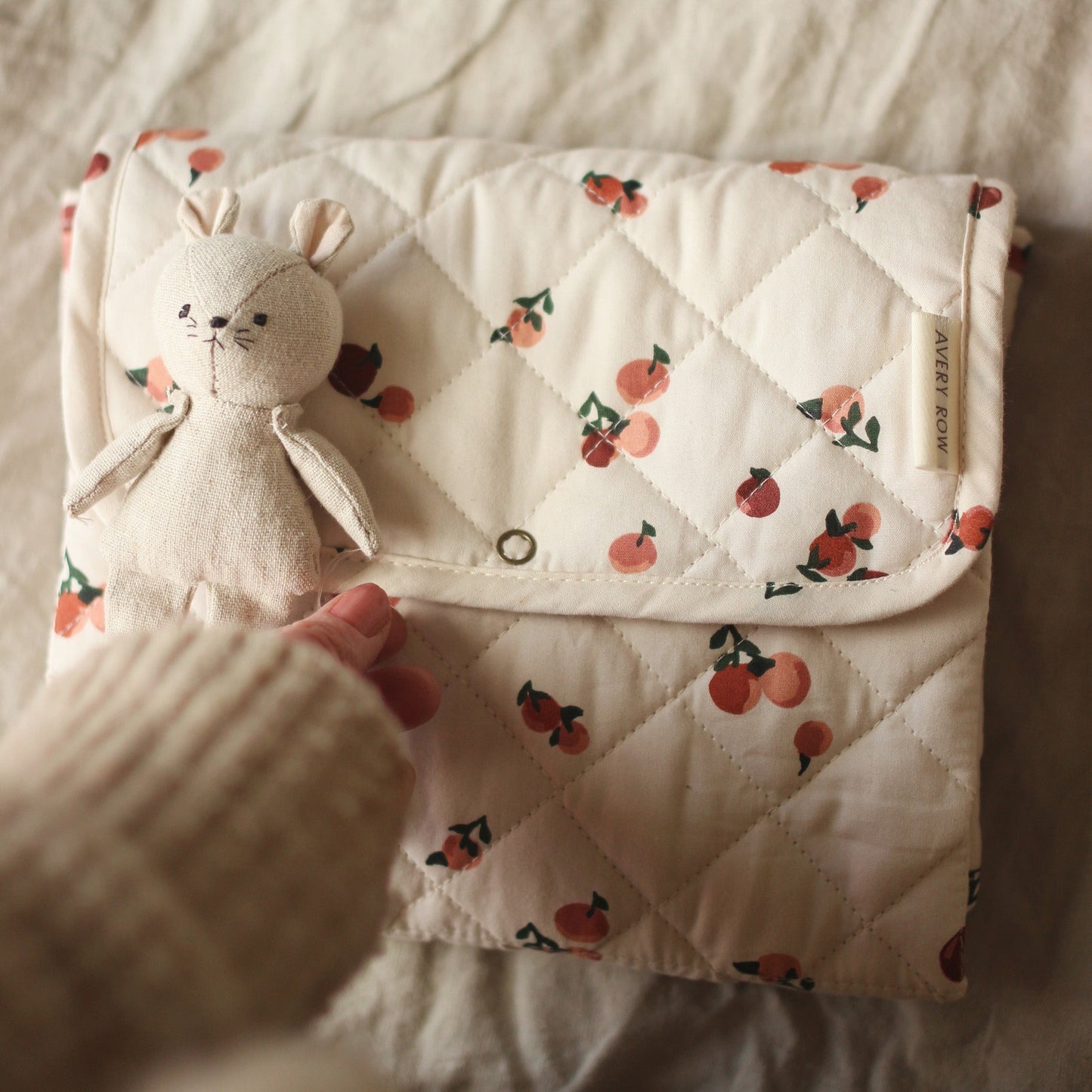 Avery Row - Travel Baby Changing Mat - closed with teddy
