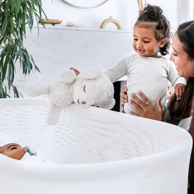 Happiest Baby SNOObear - Cream Plush -
baby in cot