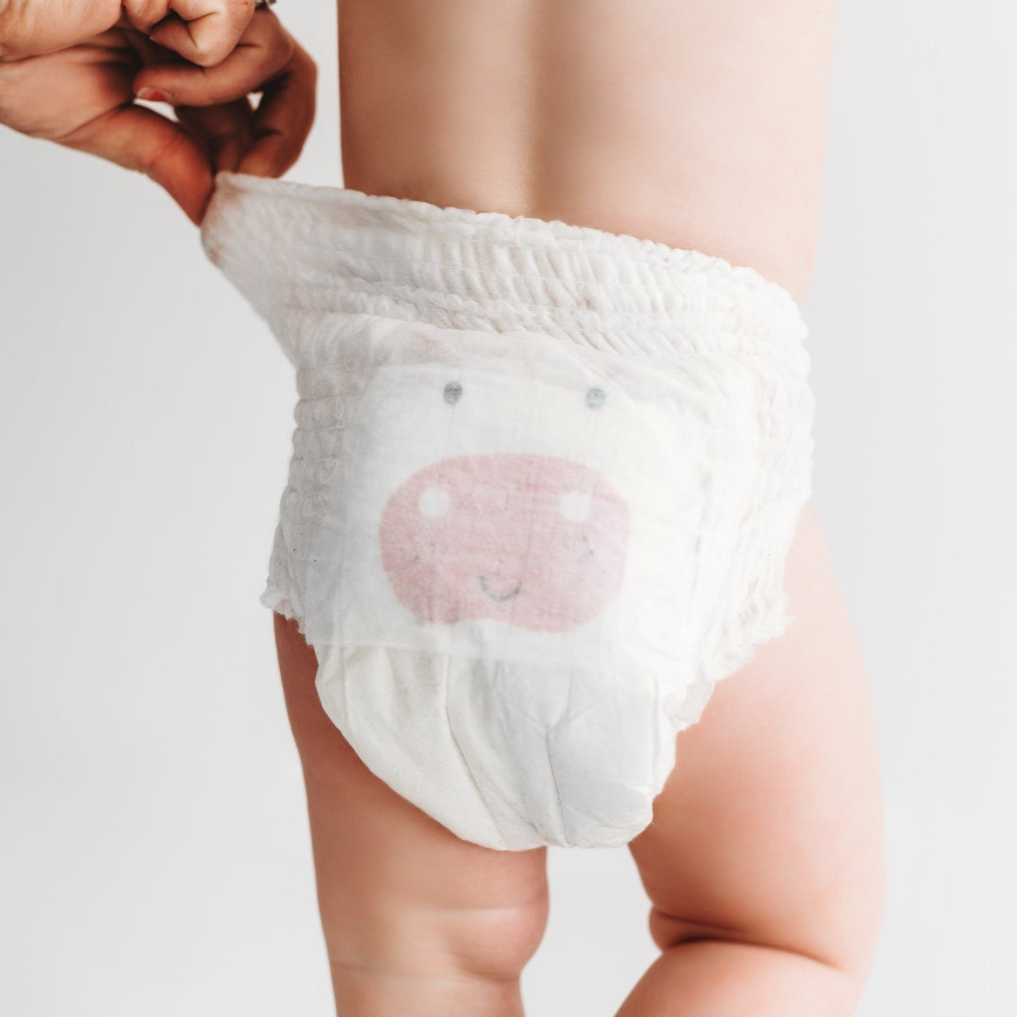 Kit & Kin nappy pull up pants size 4 - baby standing - eco nappy