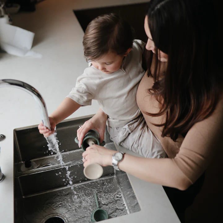 Mushie - Baby Bottle Brush - cleaning with baby