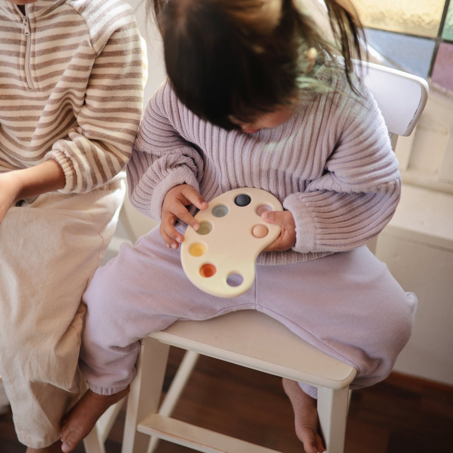 Mushie - Paint Palette Press Toy - girl playing