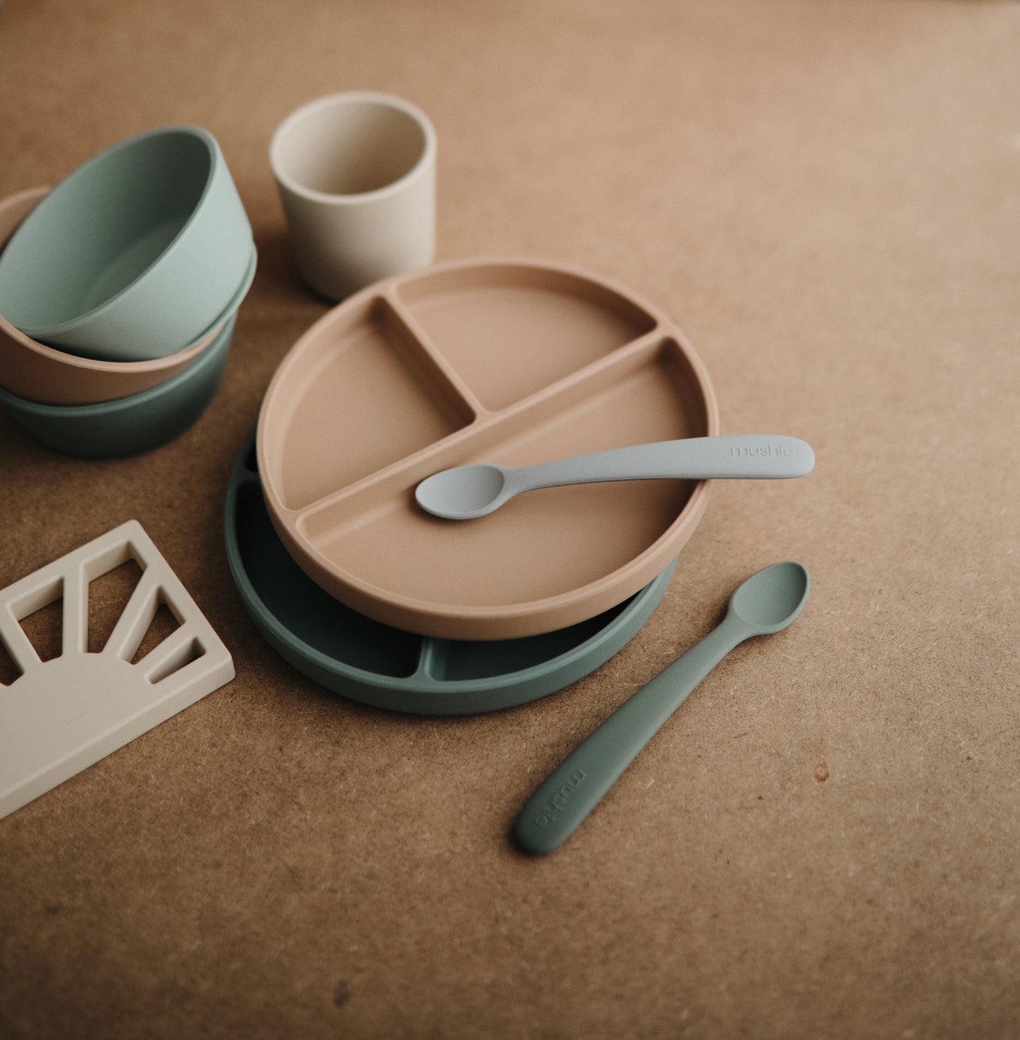 Mushie Tablewear - Silicone Suction Plate - Natural - stacked with greens - mushie plate