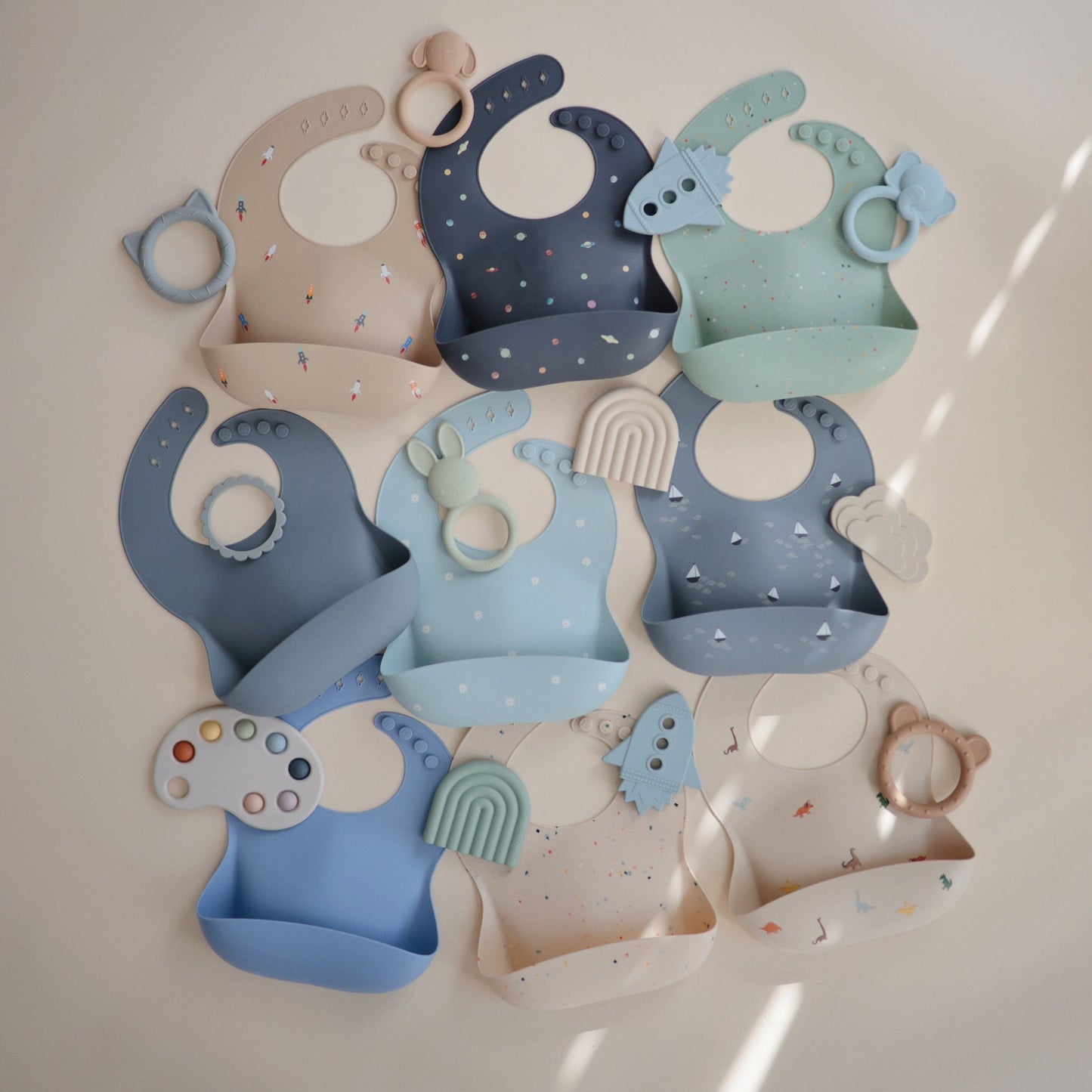 Mushie - Baby Silicone Bib - Planets - mix and match blue and cream collection