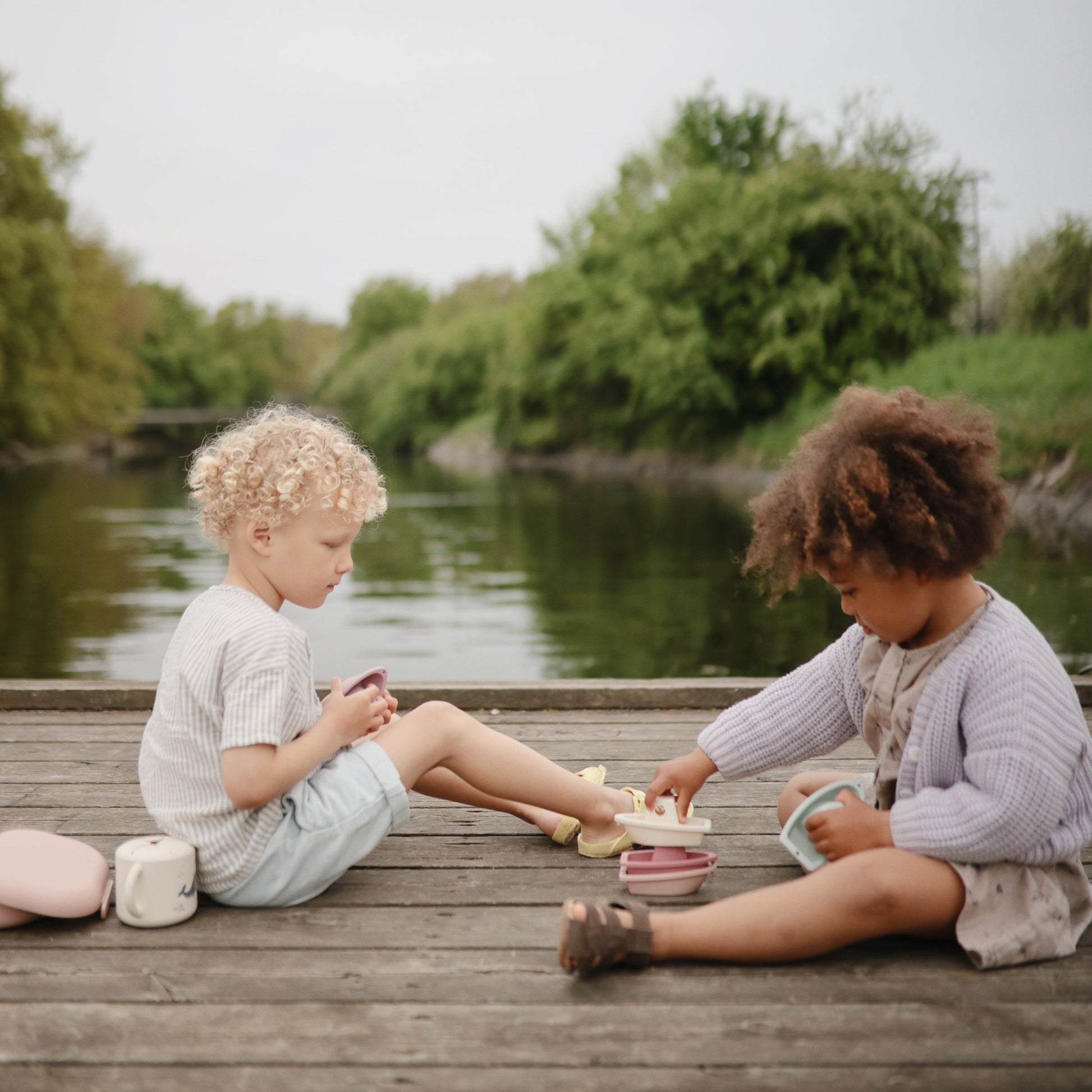 Mushie - Bath Boats - Petal - kids playing outside - mushie bath boats