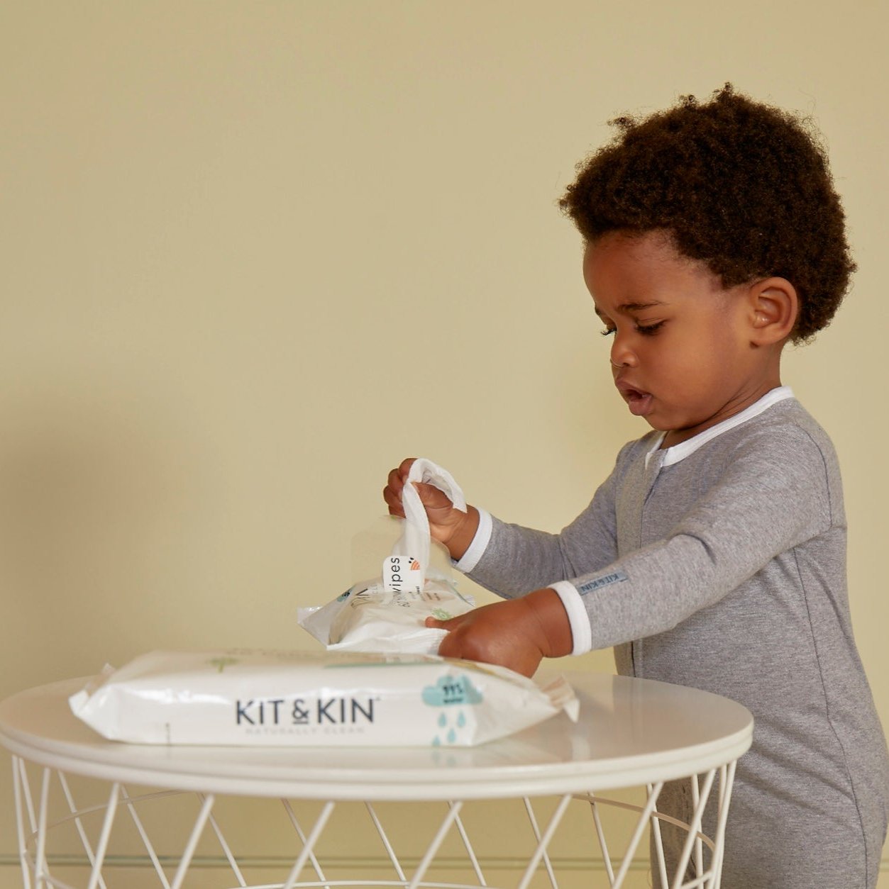 Kit  Kin Baby Wipes - boy with wipes at table - antibacterial wipes