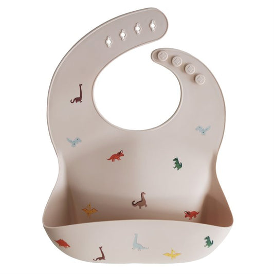 Mushie Silicone Bib - dinosaurs - no background